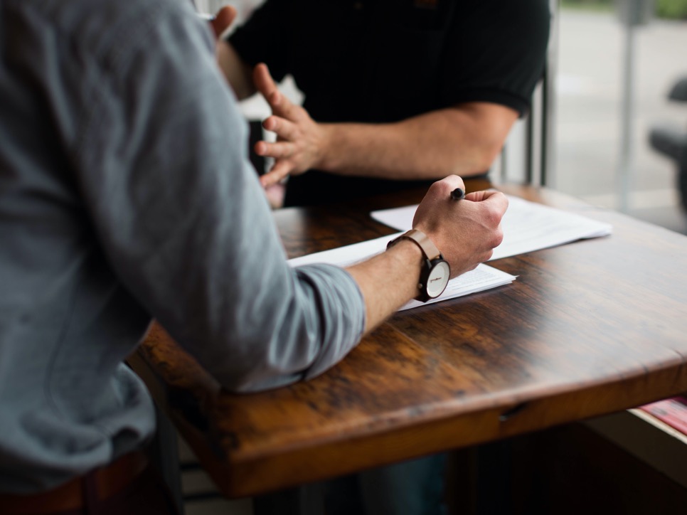 People having a meeting at a table